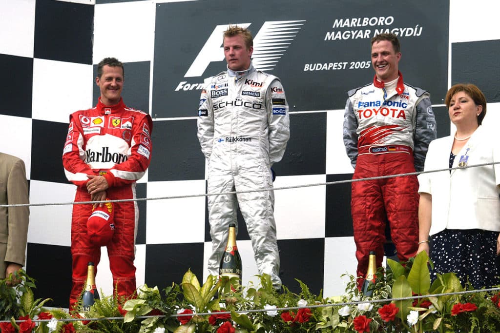 Ralf and Michael Schumacher on the podium in Budapest 2005. Credit: Ferrari